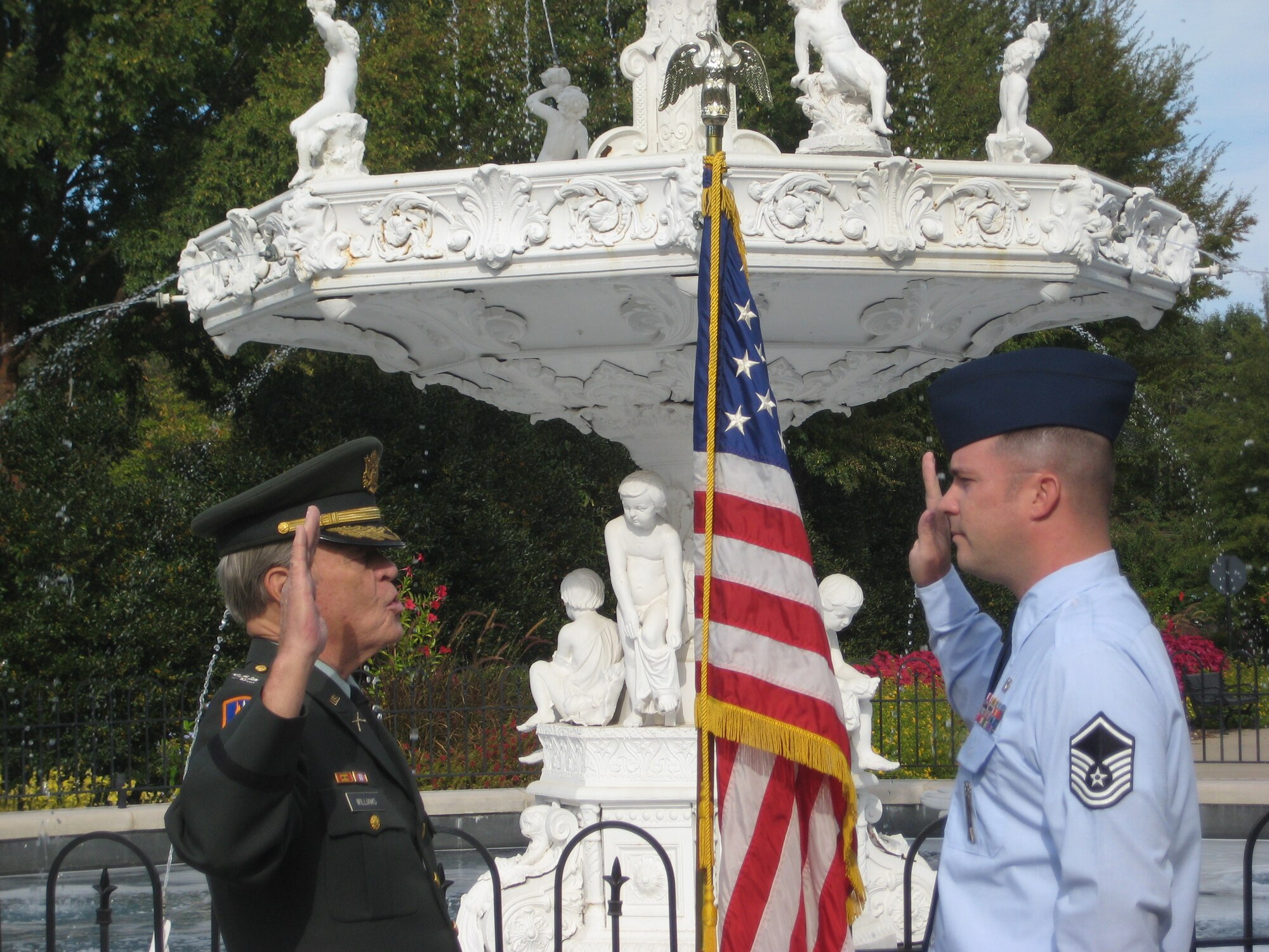 Retired Army Col. Frank Williams, left, administers the oath of enlistment to his grandson, Master Sgt. Kenneth Williams, 341st Maintenance Group Quality Assurance chief inspector, during his re-enlistment ceremony held Oct. 7 in Franklin, Tenn.  Frank put on his uniform for the first time since his retirement in 1987 for this special occasion.  (U.S. Air Force Courtesy Photo)  