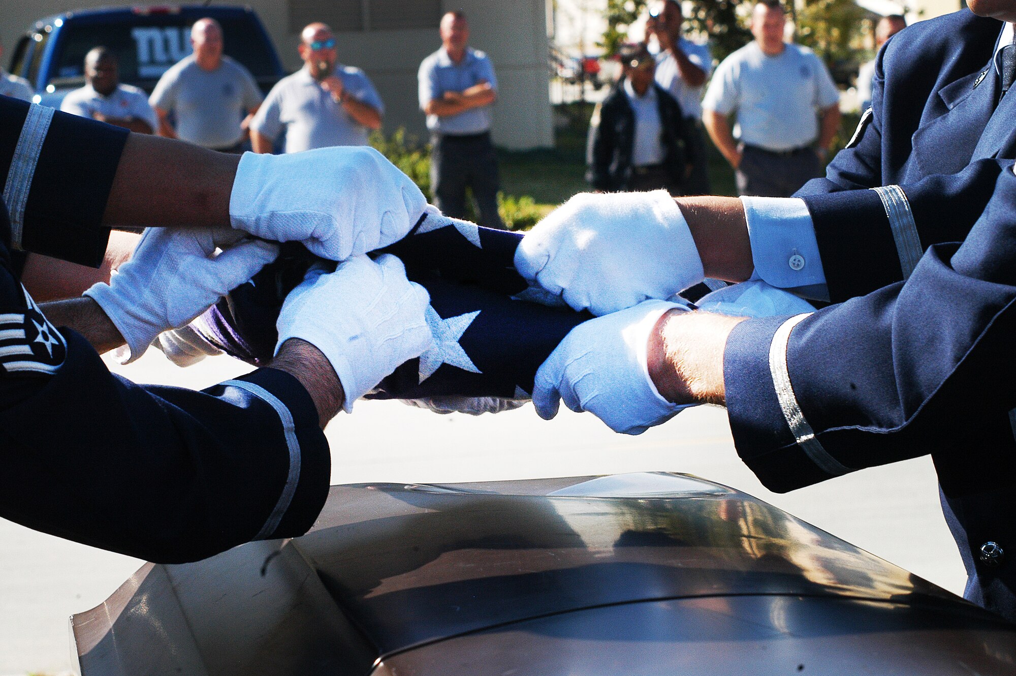 Georgia State Patrol officers observe as the Robins Honor Guard perform a funeral demonstration.Thirty One Georgia State Patrol honor guard members from around the state trained with the Robins Air Force Base Honor Guard Oct. 16-17. The GSP officers' goal was to improve techniques for their funeral and ceremonial services.(U. S. Air Force photo/Sue Sapp)