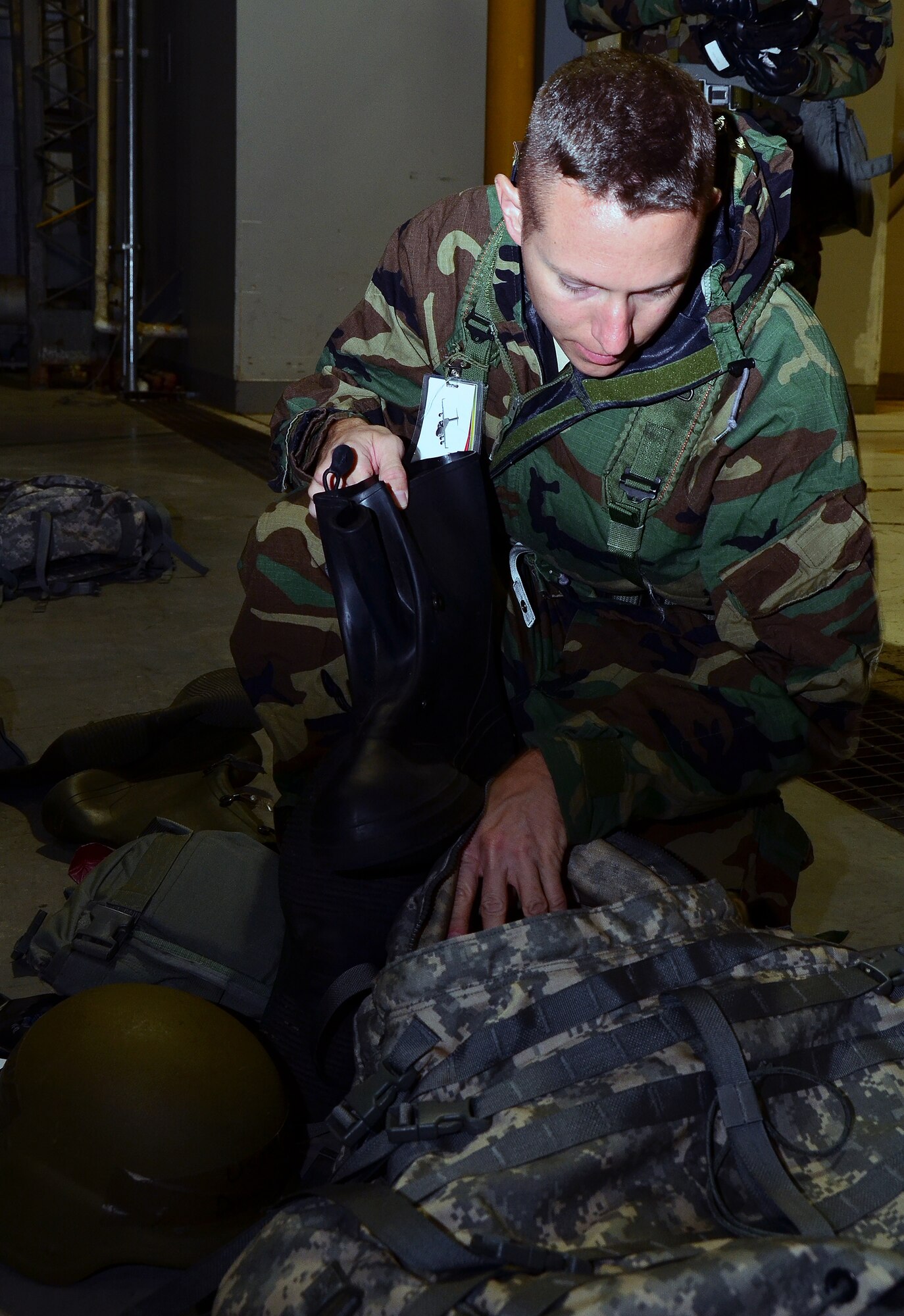 WRIGHT-PATTERSON AIR FORCE BASE, Ohio – Senior Master Sgt. Darrell Mellars, 445th Aircraft Maintenance Squadron, inspects his gear during a training exercise in preparation for the wing’s upcoming operational readiness inspection. Approximately 55 reservists from the 445th Maintenance Group participated in the training held during the Oct. 14 unit training assembly. (U.S. Air Force photo/Staff Sgt. Amanda Duncan)