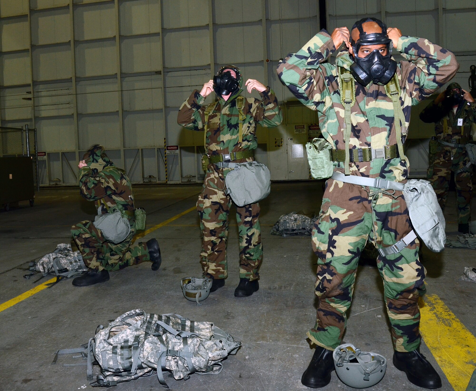 WRIGHT-PATTERSON AIR FORCE BASE, Ohio – (on the right) Tech. Sgt. Keric Johnson along with approximately 55 other reservists from the 445th Maintenance Group prepare for the operational readiness inspection by practicing going from mission oriented protective posture 2 to 4 in two minutes during the Oct. 14 unit training assembly. (U.S. Air Force photo/Staff Sgt. Amanda Duncan)