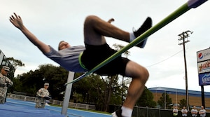 U.S. Army Sgt. Brian Dorgan, U.S. Army Training and Doctrine Command Band trombonist, clears the bar during a high jump during the German Armed Forces Badge for Proficiency competition at Hampton University in Hampton, Va., Sept. 19, 2012.  To earn the badge, participants must complete a myriad of athletic and military skill events, including swimming, track and field, and marksmanship challenges. (U.S. Air Force photo by Staff Sgt. Wesley Farnsworth/Released)