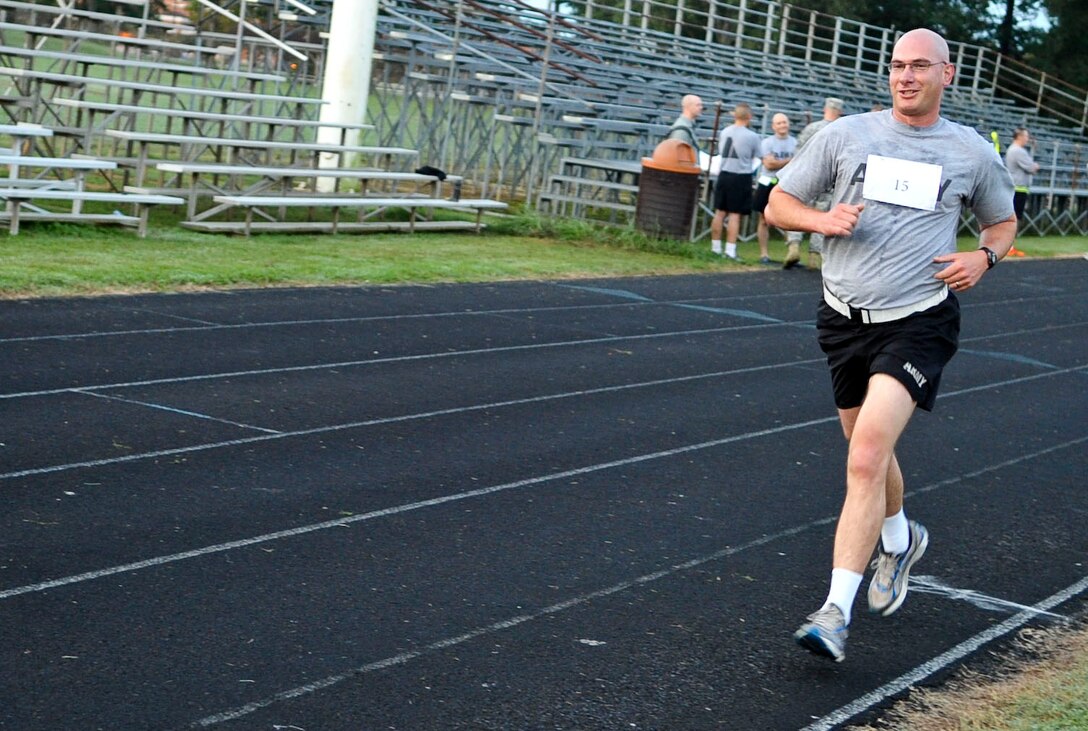 U.S. Army 1st Lt. Scott Lechner, 271st Movement Control Team commander, completes a lap during a 5k run on the Murphy Field track at Fort Eustis, Va., as part of a the qualifying events for the German Armed Forces Badge for Proficiency, Sept. 20, 2012. Thirty-three Soldiers participated in the competition to earn the badge, an honor bestowed by the German Army. (U.S. Air Force photo by Staff Sgt. Wesley Farnsworth/Released)