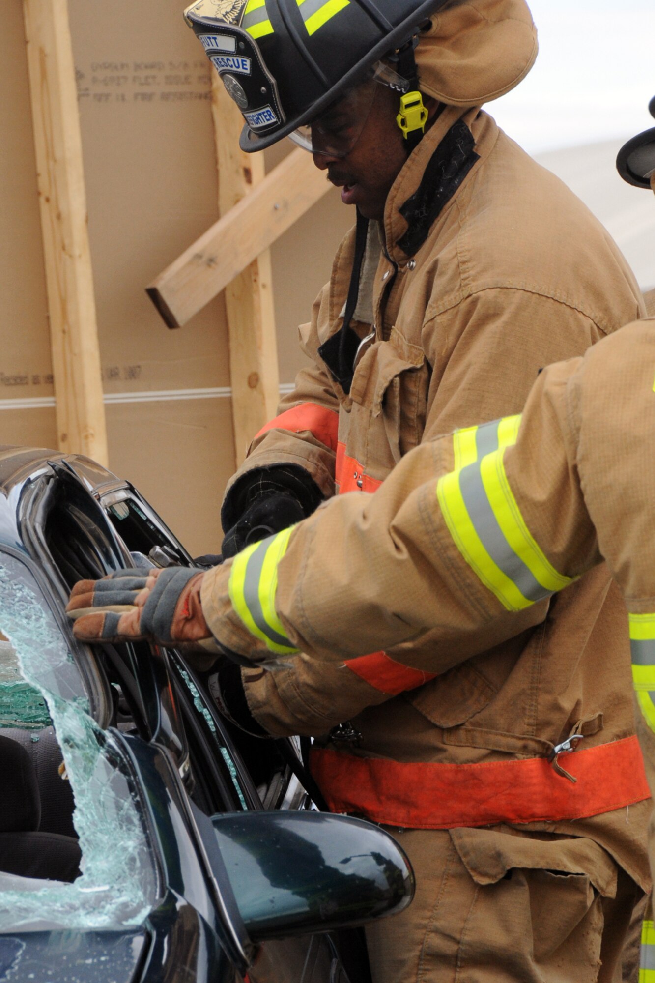 Michael Whitfield, a firefighter with the Offutt Fire Department, demonstrates prying a car apart during the Fire Prevention Week Open House at the Offutt Air Force Base Fire Station Oct. 13. The Offutt Fire Department hosted activities during Fire Prevention Week to promote "Have Two Ways Out!" through educational and family-oriented activities. (U.S. Air Force photo by Kendra Williams/Released)