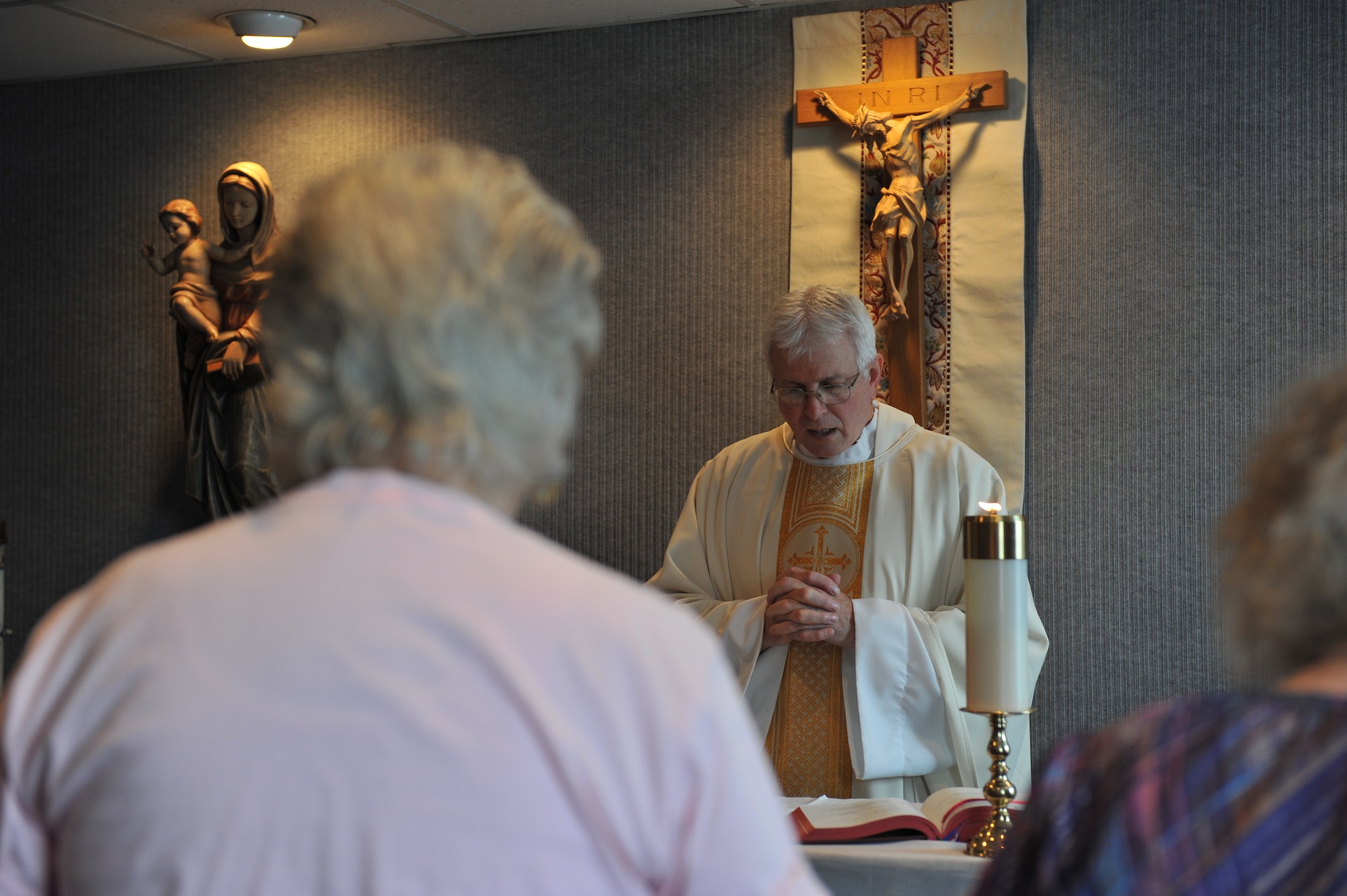 WHITEMAN AIR FORCE BASE, Mo. -- Chaplain (Lt. Col.) William Bartoul, 509th Bomb Wing Chaplain, conducts a Catholic Mass service at the Whiteman Chapel Oct. 4. Mass services are offered Saturday, 5 p.m., Sunday, 11 a.m., and Monday through Thursday at 11:30 a.m. (U.S. Air Force photo/Heidi Hunt)