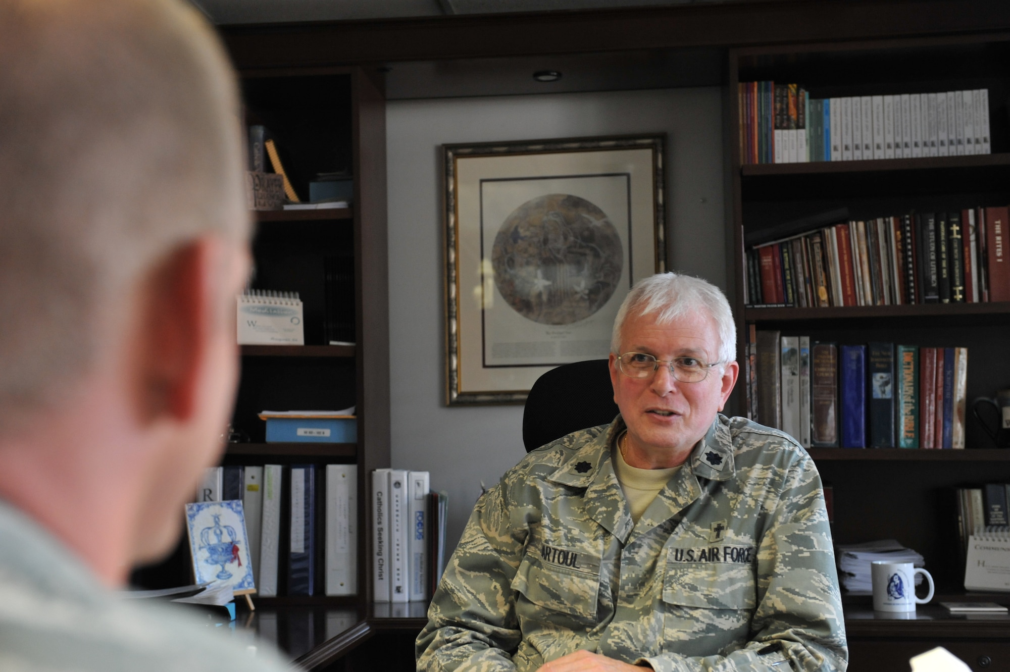 WHITEMAN AIR FORCE BASE, Mo. -- Chaplain (Lt. Col.) William Bartoul, 509th Bomb Wing Chaplain, offers spiritual guidance to an Airman at the Whiteman Chapel Oct. 1. Being able to talk to a chaplain about anything, knowing there will be no repercussions, allows Airmen a place of safety, comfort, and help, with no strings attached. (U.S. Air Force photo/Heidi Hunt)