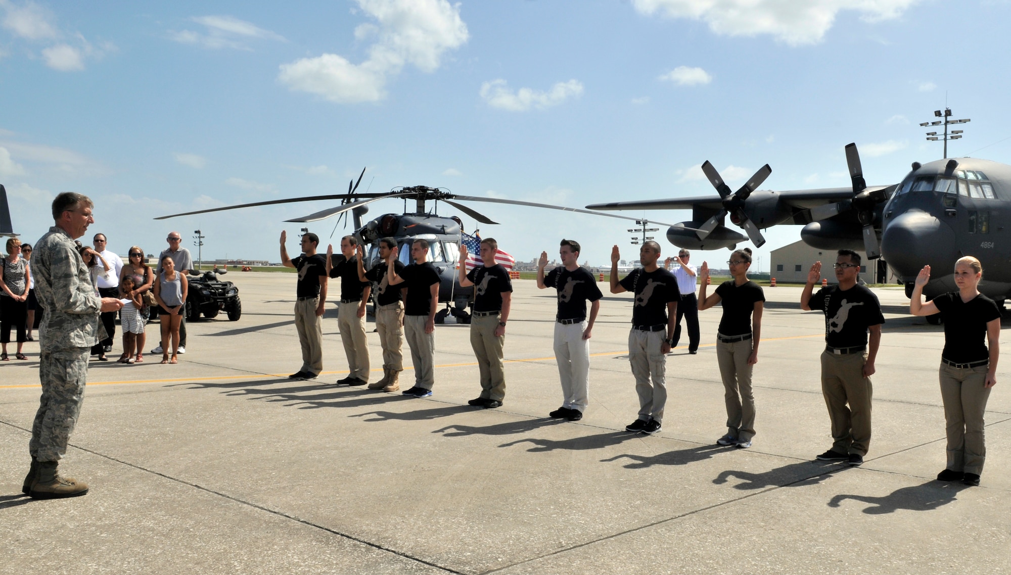 As family and friends look on, the 920th Rescue Wing Commander Col. Jeffrey Macrander administered the Oath of Enlistment to the newest members of the Wing. A mass enlistment was held on the 920th flight line during the October UTA. (U.S. Air Force photo/Tech. Sgt. Peter Dean)
