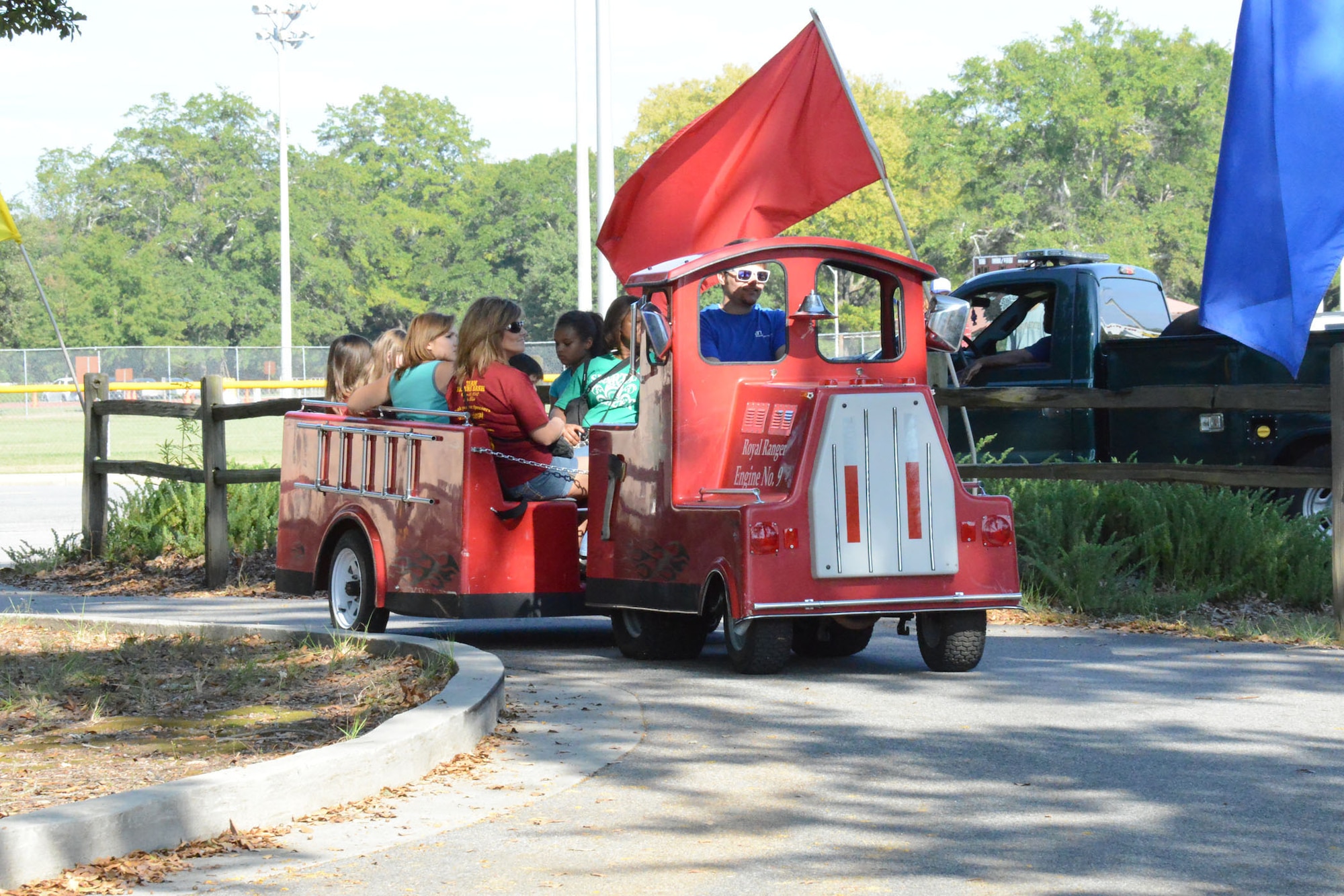 Families enjoy one of the many rides at the Team Robins Bash at Robins Park.(U. S. Air Force photo/Ed Aspera)