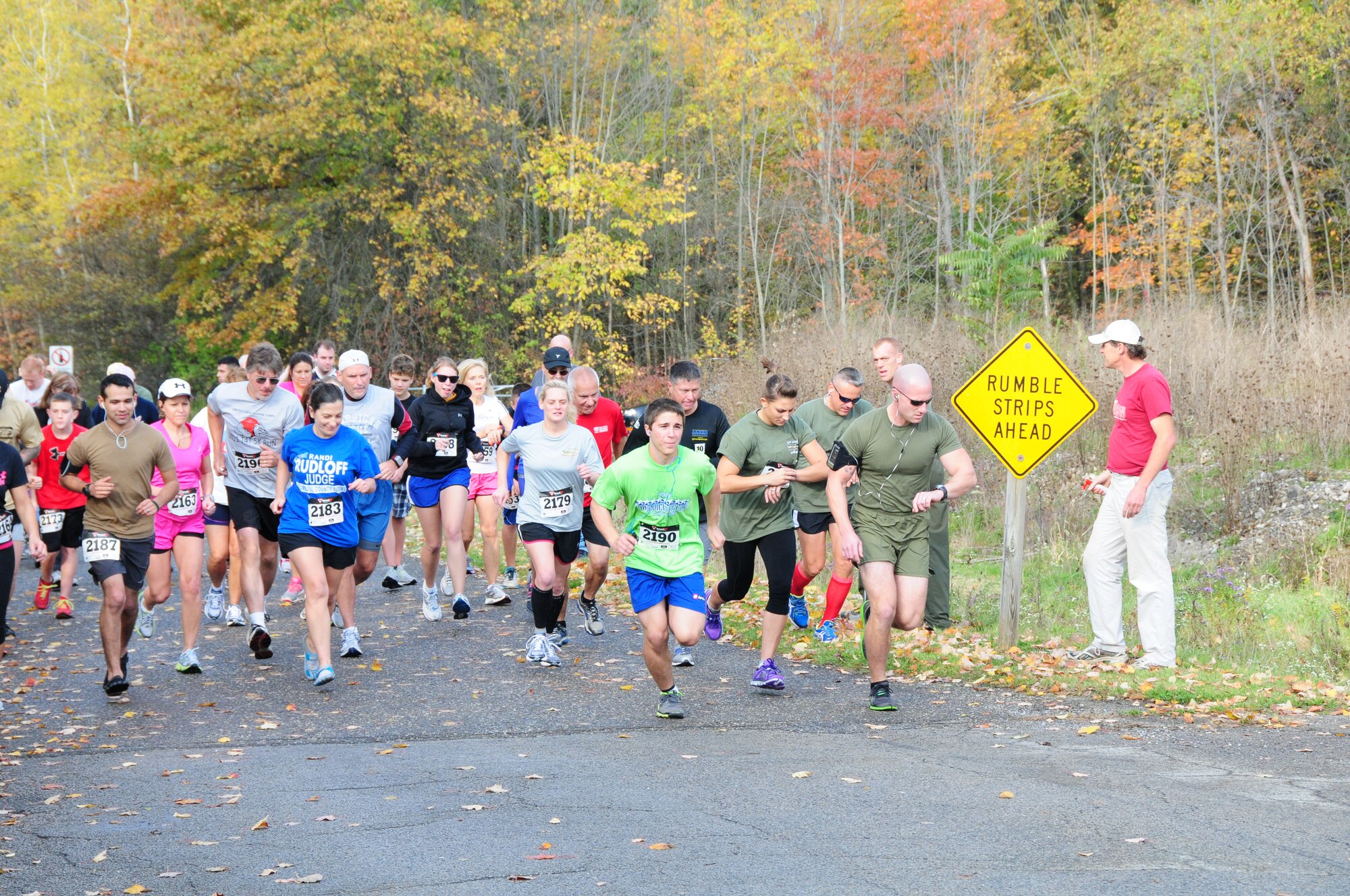 Runners take off from the start line at the Marine Corps Reserve Landing Support Equipment Company’s second annual Toys for Tots 5K race at Imagination Station Park in Cortland, Ohio, Oct. 14. The event kicked off the local annual Toys for Tots campaign that exists to collect new unwrapped toys during October, November and December each year and distribute those toys as Christmas gifts to less fortunate children in the community in which the campaign is conducted. U.S. Air Force photo by Technical Sgt. Rick Lisum.