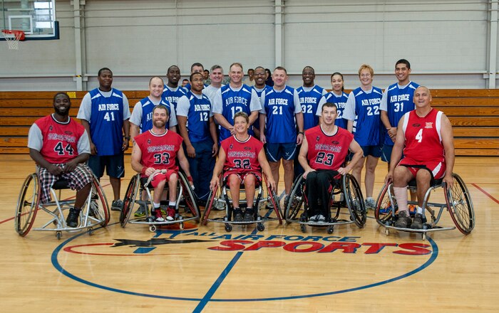 Team members from Joint Base Charleston and the North Charleston Rolling Hurricanes pose for a photo after a wheelchair basketball game Oct. 17, 2012, at Joint Base Charleston - Air Base. The North Charleston Rolling Hurricanes beat Team Joint Base Charleston 48 - 10. (U.S. Air Force photo/Airman 1st Class Ashlee Galloway)