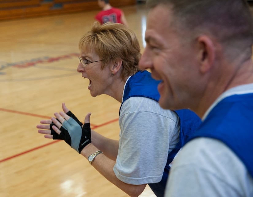 Col. Judith Hughes, 628th Medical Group commander and Col. Richard McComb, Joint Base Charleston commander, cheer on the Joint Base Charleston team during a wheelchair basketball game against the North Charleston Rolling Hurricanes Oct. 17, 2012. The wheelchair basketball game took place in honor of National Disability Awareness month. (U.S. Air Force photo/Airman 1st Class Ashlee Galloway)