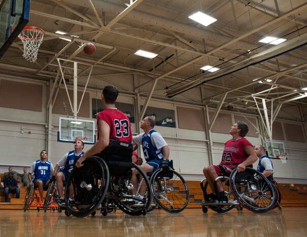 Joint Base Charleston Airmen and the North Charleston Rolling Hurricanes compete in a wheelchair basketball game Oct. 17, 2012, at Joint Base Charleston - Air Base. The North Charleston Rolling Hurricanes are a wheelchair basketball team sponsored by the Achieving Wheelchair Equality. AWE is dedicated to encouraging people with mobility impairments to participate in recreational activities. (U.S. Air Force photo/Airman 1st Class Ashlee Galloway)