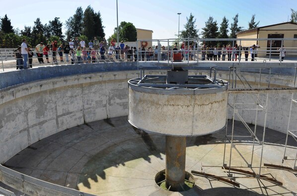 Middle-school students view how large one of the waste processing tanks at the waste-water treatment facility is Oct. 16, 2012, at Incirlik Air Base, Turkey. The tanks are used to clean the water and can contain around 300,000 gallons. (U.S. Air Force photo by Senior Airman Anthony Sanchelli/Released)
