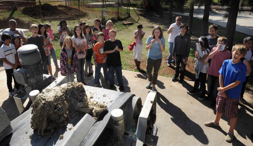 Sixth and seventh-graders learn how waste is processed at the waste-water treatment facility Oct. 16, 2012, at Incirlik Air Base, Turkey. The students discovered the first process in waste-water treatment was by far the most pungent. (U.S. Air Force photo by Senior Airman Anthony Sanchelli/Released)
