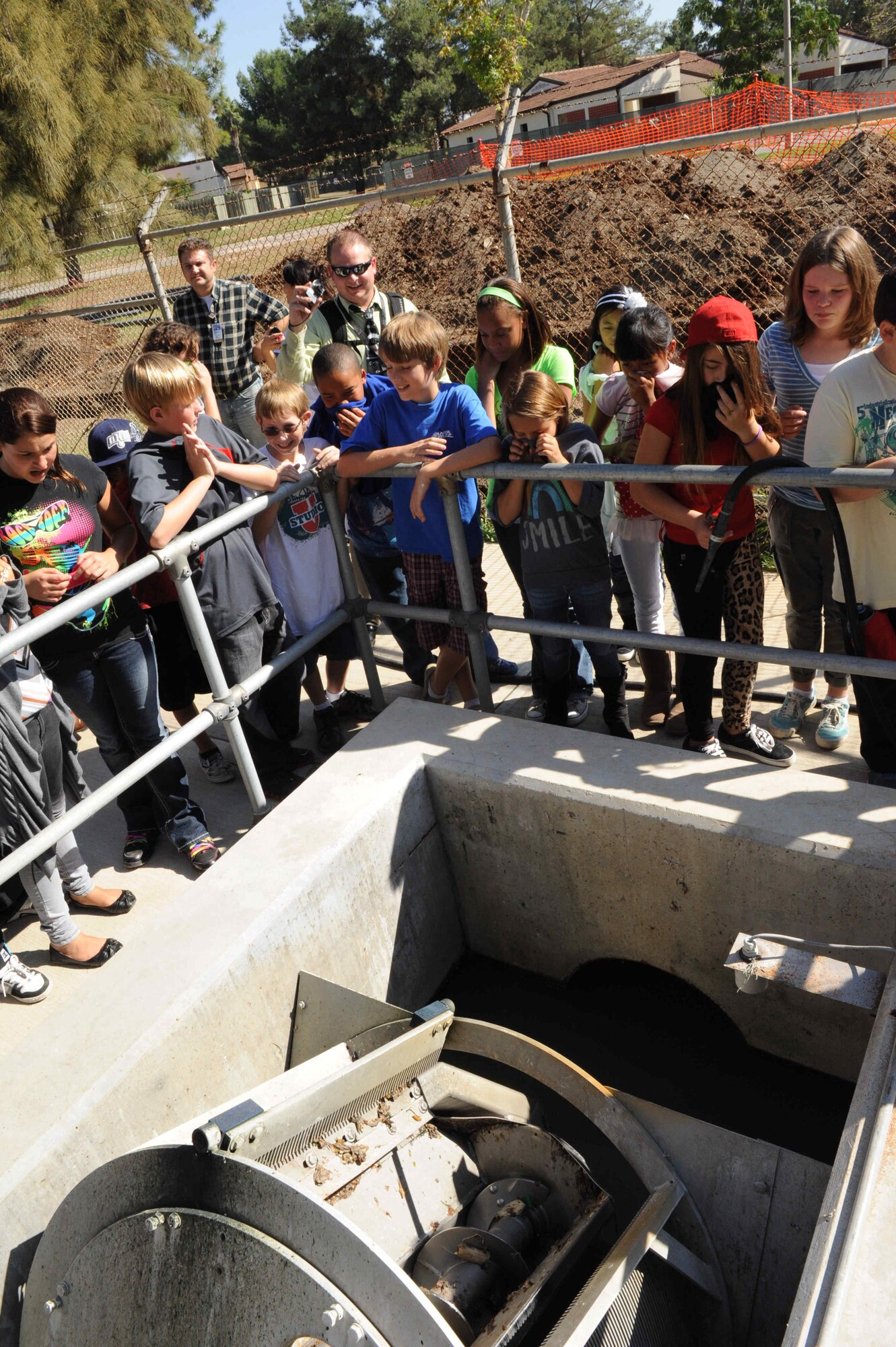 Middle-school students from the Incirlik Unit School, learn how waste is processed at the waste-water treatment facility Oct. 16, 2012, at Incirlik Air Base, Turkey. The students discovered the first process in waste-water treatment was by far the most pungent. (U.S. Air Force photo by Senior Airman Anthony Sanchelli/Released)
