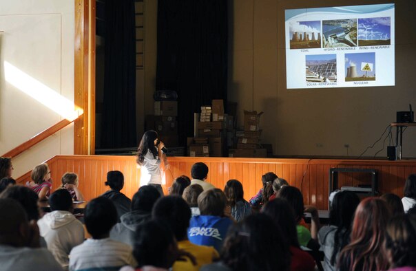Pinar Oneren, 39th Civil Engineer Squadron mechanical maintenance engineer, standing, gives a presentation on energy conservation to sixth and seventh-graders Oct. 16, 2012, at the Incirlik Unit School, Incirlik Air Base, Turkey. The presentation went over different forms of energy as well as useful ways to save it. (U.S. Air Force photo by Senior Airman Anthony Sanchelli/Released)