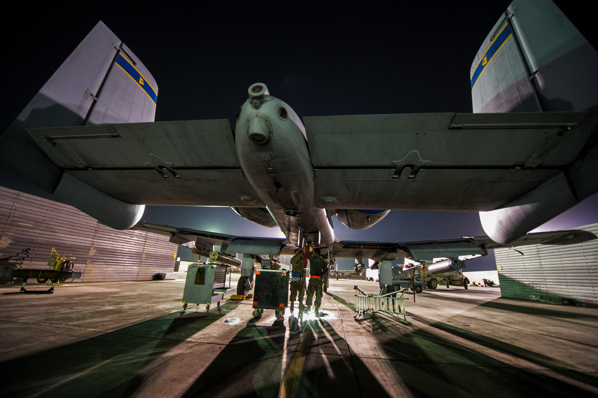 SSgt. Marc Bapp, left, and SrA James Weishaupt, right, 455th Expeditionary Aircraft Maintenance Squadron crew chiefs, perform routine maintenance on an A-10 Thunderbolt II on Oct. 16, 2012, Bagram Airfield, Afghanistan. Bagram maintainers work around the clock to keep their “Warthogs” ready to fly close air support missions in support of coalition ground forces. Bapp hometown is Lewisville, Texas and Weishaupt hometown is Tucsan, Ariz. (U.S. Air Force photo/ Staff Sgt. Jonathan Snyder) 