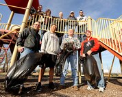 MINOT AIR FORCE BASE, N.D -- Team Minot Airmen pose for a group photo after completing a clean-up of Bud Ebert Park here, Oct. 13. The group removed debris and trash from the playground and surrounding areas for approximately two hours. Their work helps provide a sanitary and appealing park environment for base residents and their families to enjoy. (U.S. Air Force photo/Airman 1st Class Stephanie Ashley)
