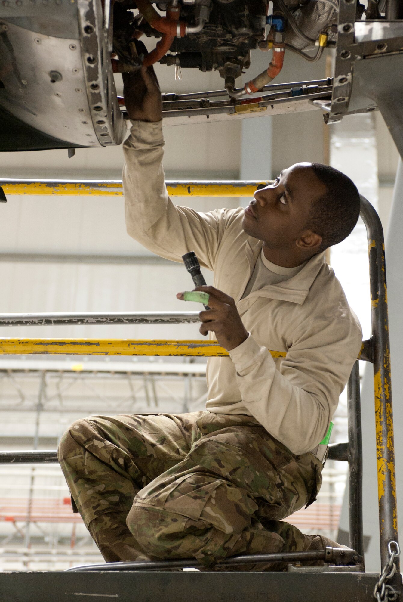 455th Expeditionary Aircraft Maintenance Squadron maintainer A1C Akeem Jackson, from New York City, examines an engine on a U.S. Air Force C-130 Hercules during a comprehensive aircraft inspection at Bagram Airfield, Afghanistan Oct. 17, 2012. The maintainers work long hours to ensure Bagram’s Hercules fleet is ready to transport people and supplies throughout Afghanistan. (U.S. Air Force Photo/SSgt Jeff Nevison)