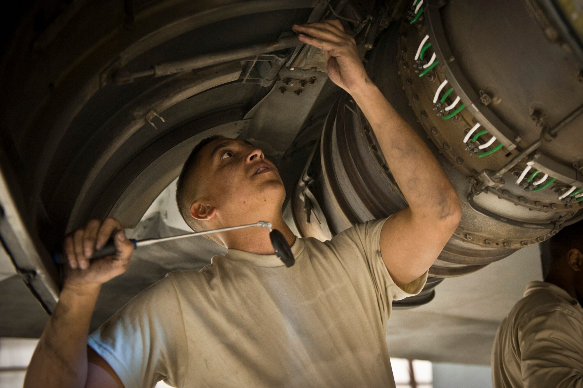 SrA Pedro Rivera King, a maintainer with the 455th Expeditionary Aircraft Maintenance Squadron from Puerto Rico, examines an engine on a U.S. Air Force C-130 Hercules during a comprehensive aircraft inspection at Bagram Airfield, Afghanistan Oct. 17, 2012. The C-130 is a tactical airlift workhorse for coalition forces in Afghanistan, but its mission success depends on the labor of the maintainers who keep the “Herc” ready to fly. (U.S. Air Force Photo/Capt. Raymond Geoffroy)