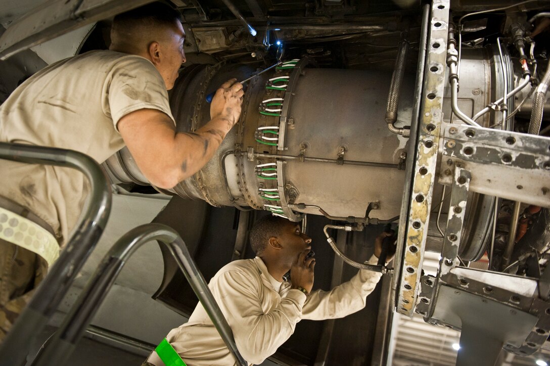 455th Expeditionary Aircraft Maintenance Squadron maintainers SrA Pedro Rivera King, from Puerto Rico, and A1C Akeem Jackson, from New York City, examine an engine on a U.S. Air Force C-130 Hercules during a comprehensive aircraft inspection at Bagram Airfield, Afghanistan Oct. 17, 2012. The maintainers work long hours to ensure Bagram’s Hercules fleet is ready to transport people and supplies throughout Afghanistan. (U.S. Air Force Photo/Capt. Raymond Geoffroy)
