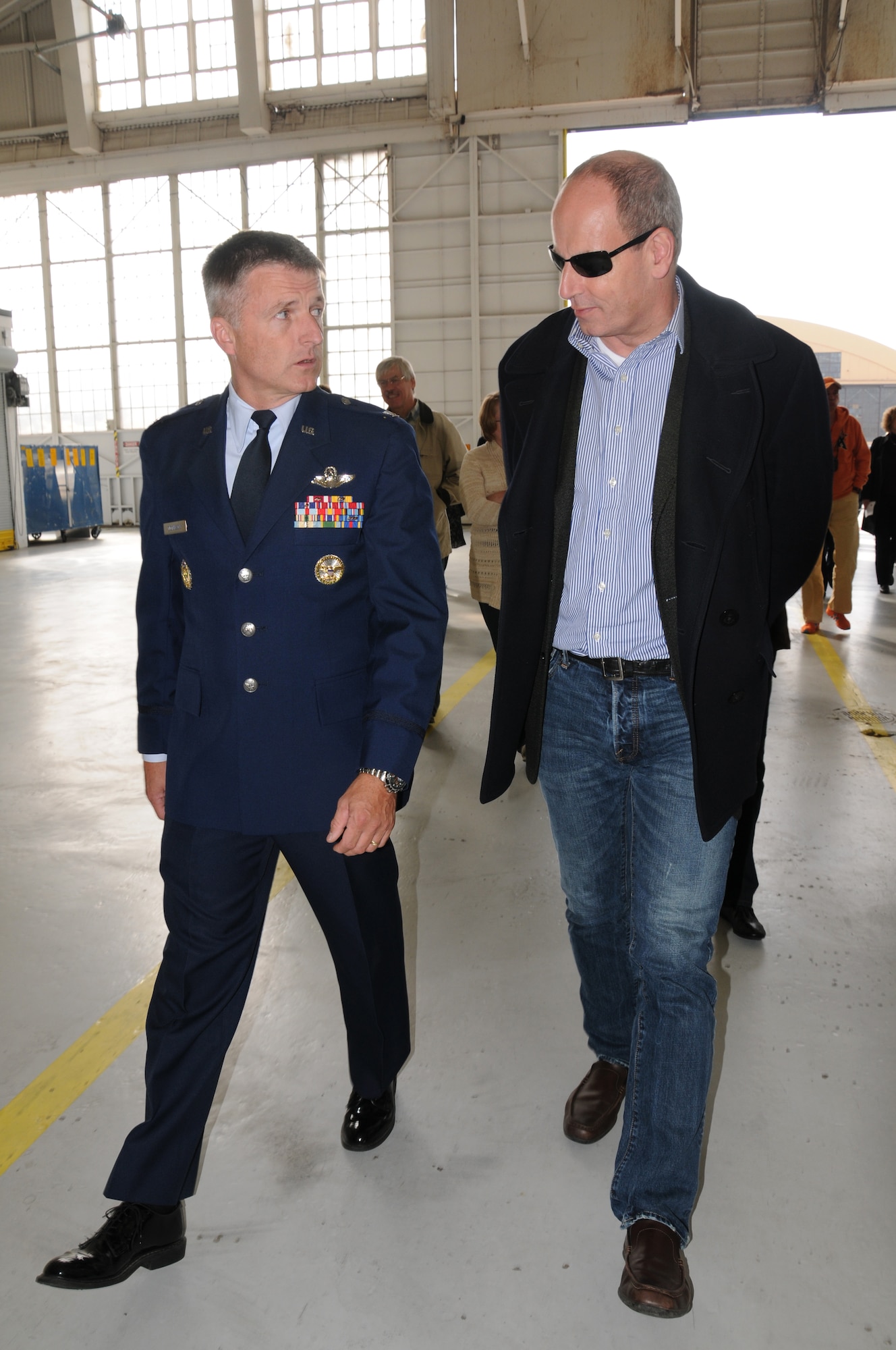 U.S. Air Force Col. Gary Dickinson, vice wing commander of the 459th Air Refueling Wing, and Jens Hanefeld, Minister Deputy Chief of Mission Embassy of the Federal Republic of Germany, Washington, D.C., walk and talk about Air Force missions during a visit to Joint Base Andrews, Md., Oct. 17. The visit included a base tour, demonstrations from the 11th Wing Security Force’s working dog team, The U.S. Air Force Honor Guard Drill Team, The U.S. Air Force Band Max Impact and aircraft displays from the 459th ARW, 1st Helicopter Squadron and the 113th Wing. The German Embassy goes out into the community each year and their visits rotate between the different branches of the embassy. This year, the embassy's military branch had the distinct privilege of hosting. (U.S. Air Force photo/ Senior Airman Katie Spencer)