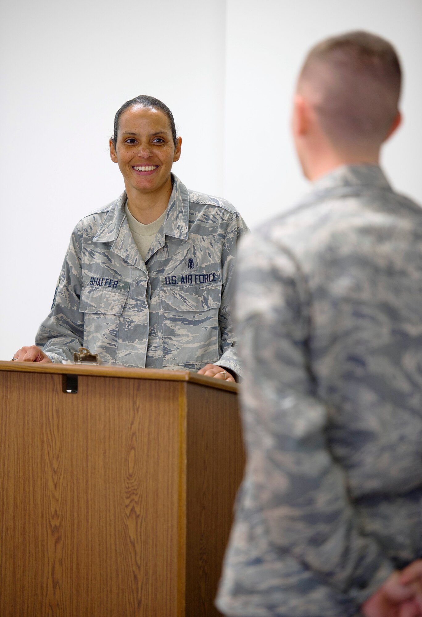 YOKOTA AIR BASE, Japan – Master Sgt. Misty Shaffer, Inspector General superintendent, speaks with an Airman at the First Term Airman Center about what services the IG office provides at Yokota Air Base, Japan, on Oct. 18, 2012. Part of the responsibilities of the IG office is to brief at certain functions such as commander’s calls, professional military education and FTAC. (U.S. Air Force photo by Staff Sgt. Chad C. Strohmeyer)