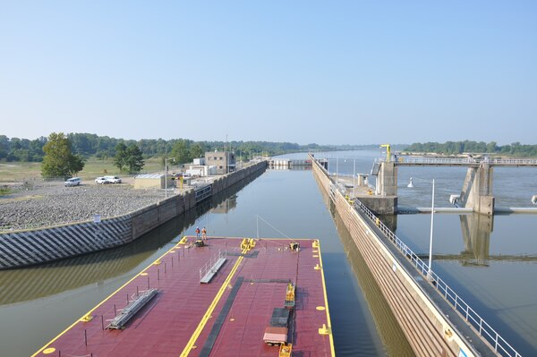 A barge makes its way through the McKlellan-Kerr Arkansas River Navigation System lock and dam. Reducing the MKARNS hours of operations is just one of the ways the U.S. Army Corps of Engineers Southwestern Division is looking to reduce costs as part of the civil works transformation. Currently, the MKARNS runs 24 hours a day, seven days a week.
