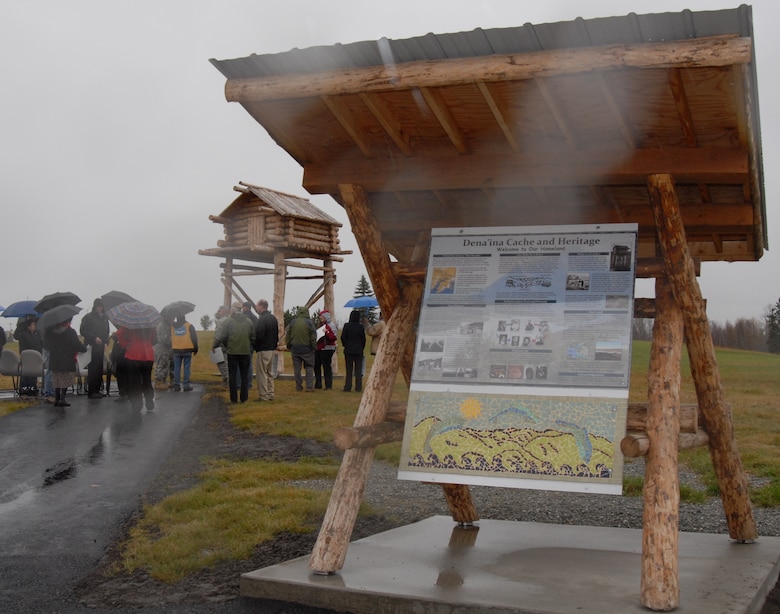 Tribal members and official party members gather to dedicate the Dena’ina Cache and Signage Display located on Joint Base Elmendorf-Richardon near the intersection of Post Road and Arctic Warrior Drive Oct. 5. The cache and display were constructed by the Native Village of Eklutna, the federally-recognized tribe closest to JBER. The project was funded by the Air Force while the U.S. Army Corps of Engineers-Alaska District provided project management and contract administration.