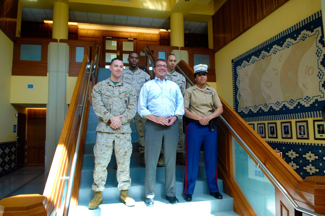 U.S. Deputy Defense Secretary Ashton B. Carter, center, meets U.S. Marines serving as embassy guards during a visit to Kuwait City, Kuwait, Oct. 17. 