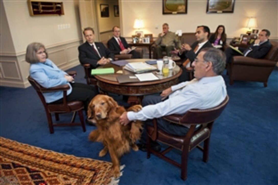 Defense Secretary Leon E. Panetta and Holly Petraeus, Consumer Financial Protection Bureau Office of Servicemember Affairs assistant director, meet in the secretary's office before briefing reporters at the Pentagon, Oct. 18, 2012.