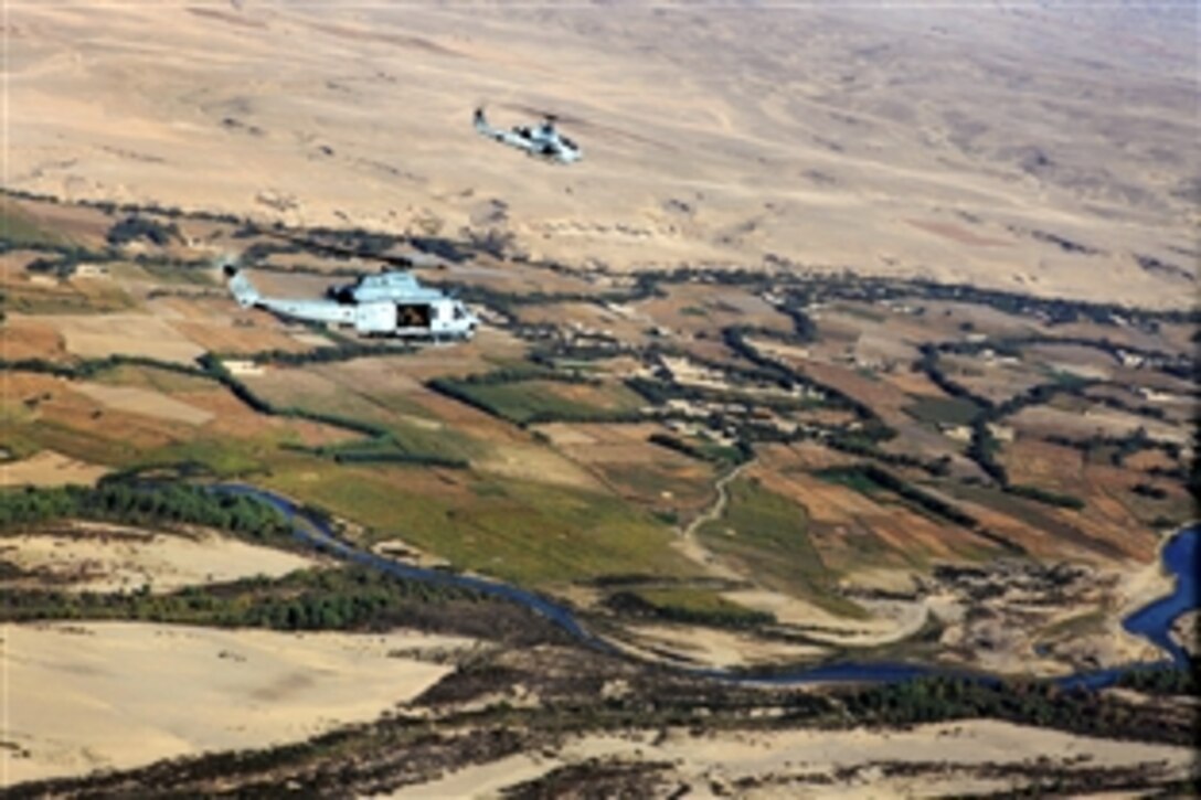 A U.S. Marine Corps UH-1Y Venom utility helicopter, front, and an AH-1W Cobra attack helicopter conduct flight operations over Afhanistan's Helmand province, Oct. 17, 2012. The helicopter crews are assigned to Marine Light Helicopter Squadron 469, Marine Aircraft Group 38, 3rd Marine Aircraft Wing.