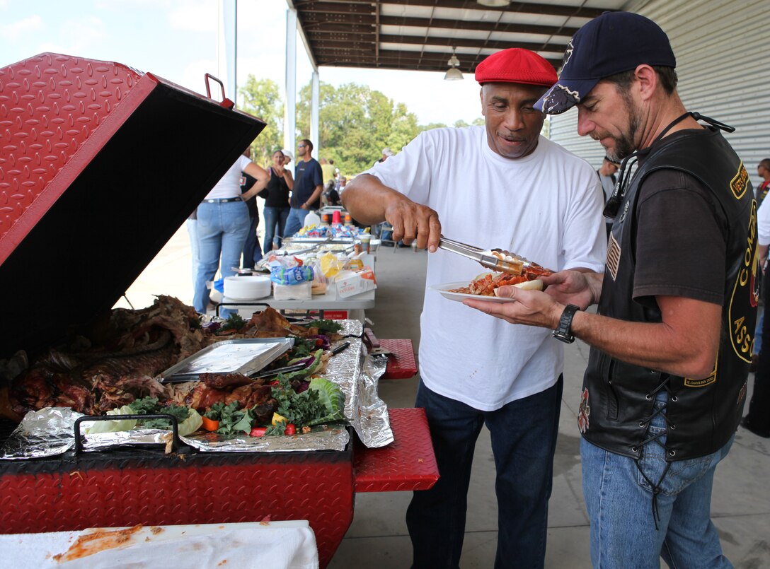 A feast fit for warriors awaits bikers at the conclusion of the Combat Veterans Motorcycle Association's Historical Markers Ride Oct. 6 in Jacksonville. Burgers, hot dogs, a roasted hog and other cookout staples were provided for the travelers.