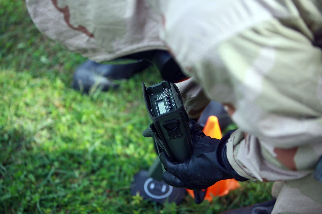 A Marine with 2nd Marine Logistics Group reads the simulated radiation results from the AN/PDR-77, a device that measures and detects radiation, during a training exercise aboard Camp Lejeune, N.C., Oct. 17, 2012. Chemical, biological, radiological and nuclear defense specialists instructed the servicemembers on how to use the sensor in contaminated environments throughout a four-day course.