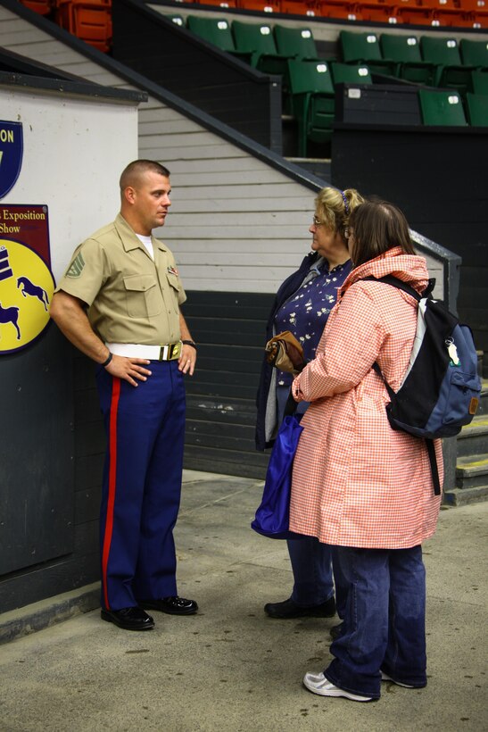 Staff Sgt. Steven Williams, a trumpet player with the 2nd Marine Division Band, greets local fairgoers before the band’s performance.  The Lancaster, Pa., native will be taking on the challenge of leading the Marine musicians as the assistant drum major for The President’s Own.