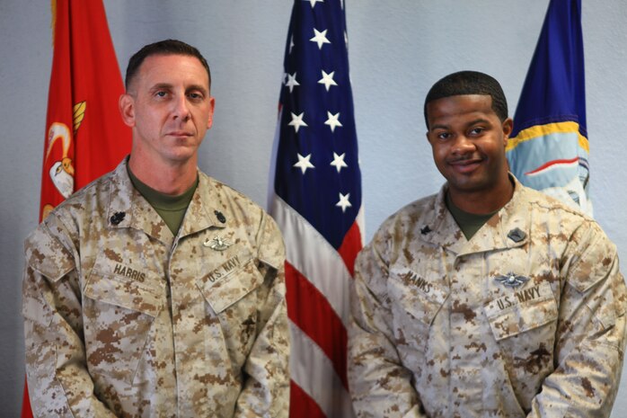 Petty Officer 3rd Class Calvin B. Hanks, the president and founding member of 2nd Dental Battalion Junior Enlisted Association, stands beside Chief Petty Officer David Harris, one of the mentors for JEA in the battalion, aboard Camp Lejeune, N.C., Oct. 18, 2012. Hanks and his fellow sailors launched JEA in September 2012 to provide a forum where junior enlisted sailors could voice their opinions, build camaraderie and directly impact their community through service projects.