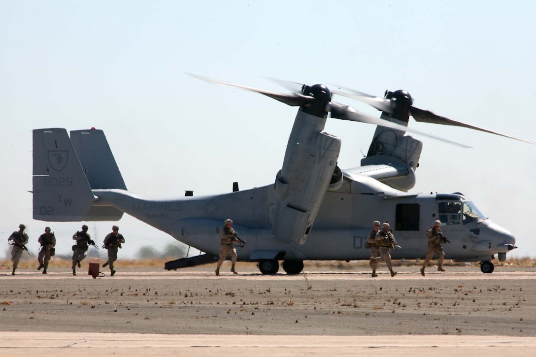 Infantry Marines from Marine Corps Base Camp Pendleton, Calif., exit an MV-22B Osprey as part of the Marine Air-Ground Task Force Demonstration during the 2012 Marine Corps Air Station Miramar Air Show, Oct. 14. The demonstration displays the different aspects of a MAGTF.