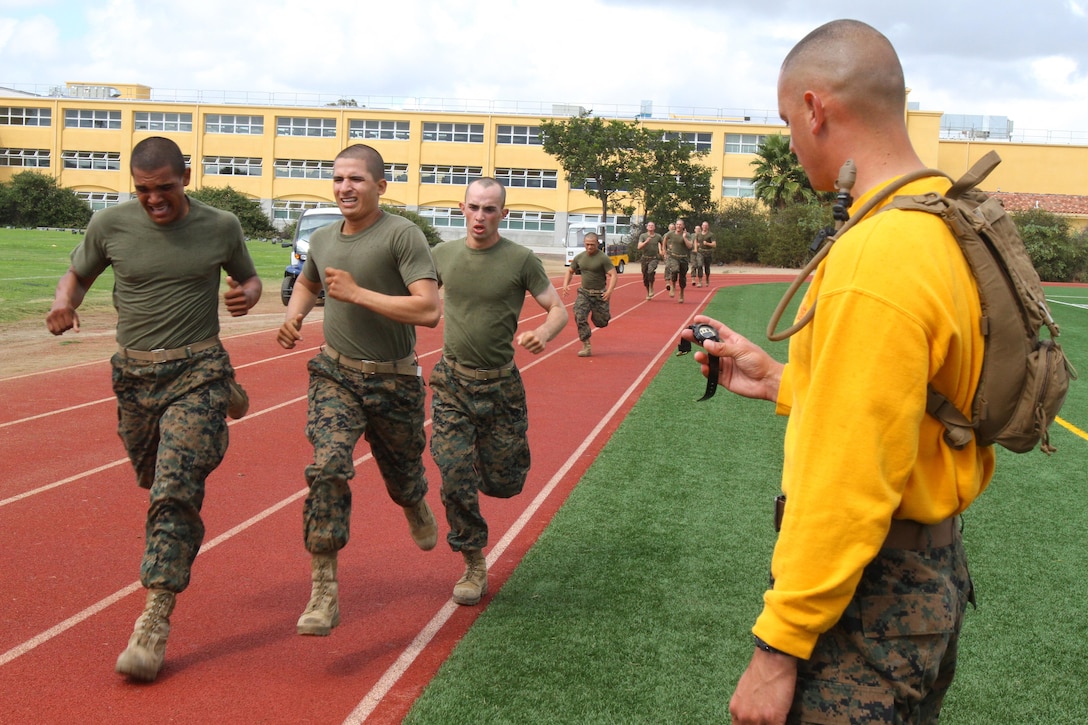 Recruits of Company G, 2nd Recruit Training Battalion, sprint around the track during their Combat Fitness Test aboard Marine Corps Recruit Depot San Diego Oct. 11. The sprint portion of the CFT consists of an 880-yard sprint known as the movement-to-contact.