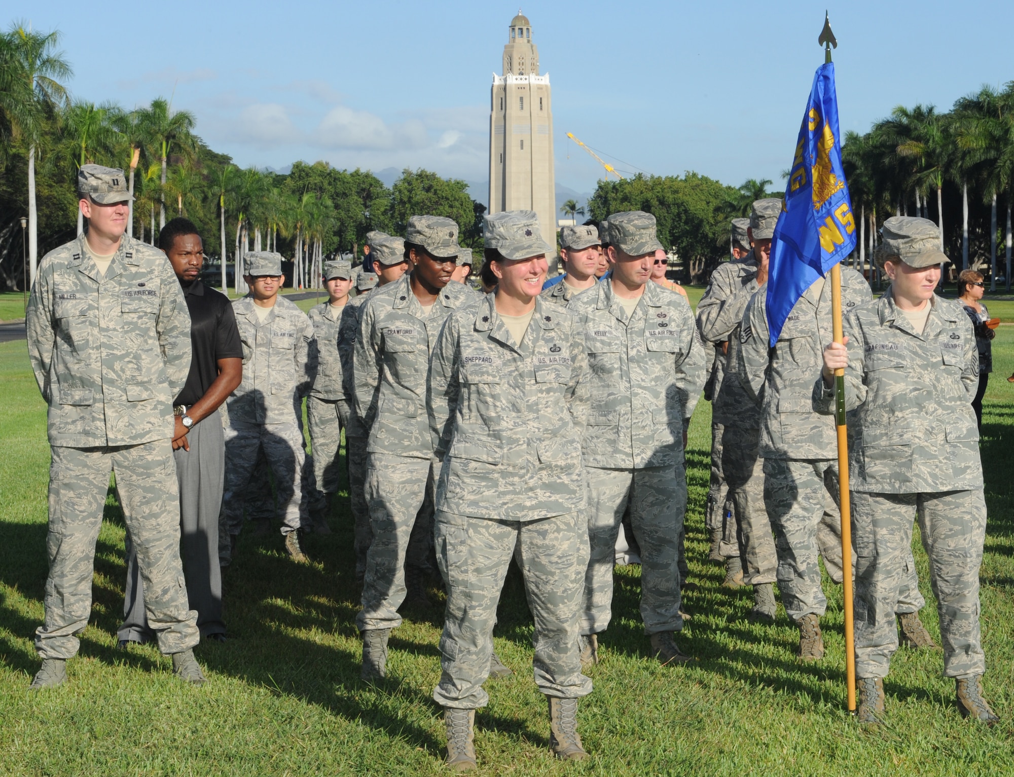 Members of the 15th Wing Staff Agencies stand at ease during the 15th WG Quarterly Awards ceremony Oct. 19 at Hickam Mall on Joint Base Pearl Harbor-Hickam, Hawaii. During the ceremony, eight individuals and one team were recognized for their service to the wing and the U.S. Air Force. (U.S. Air Force photo by Staff Sgt. Nathan Allen)