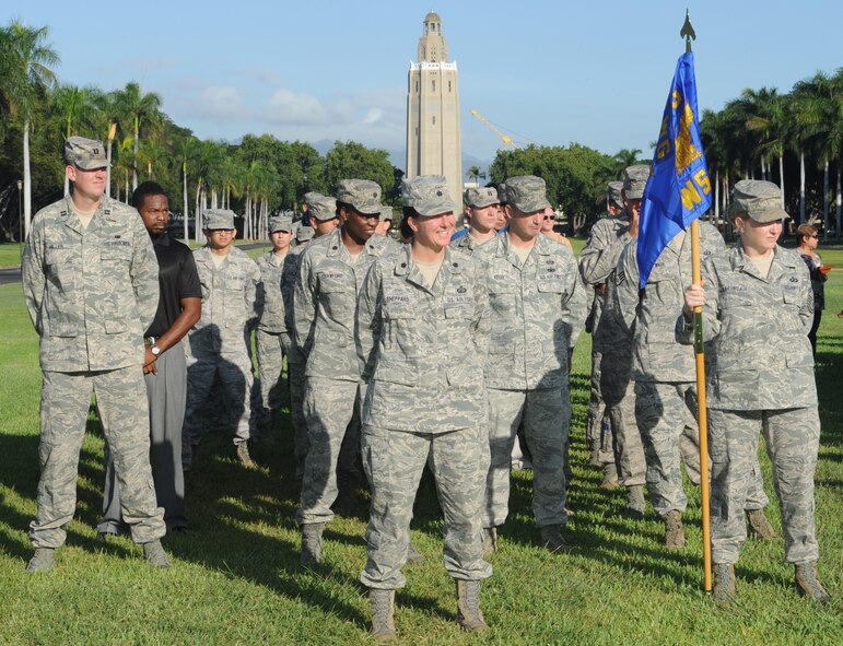 Members of the 15th Wing Staff Agencies stand at ease during the 15th WG Quarterly Awards ceremony Oct. 19 at Hickam Mall on Joint Base Pearl Harbor-Hickam, Hawaii. During the ceremony, eight individuals and one team were recognized for their service to the wing and the U.S. Air Force. (U.S. Air Force photo by Staff Sgt. Nathan Allen)