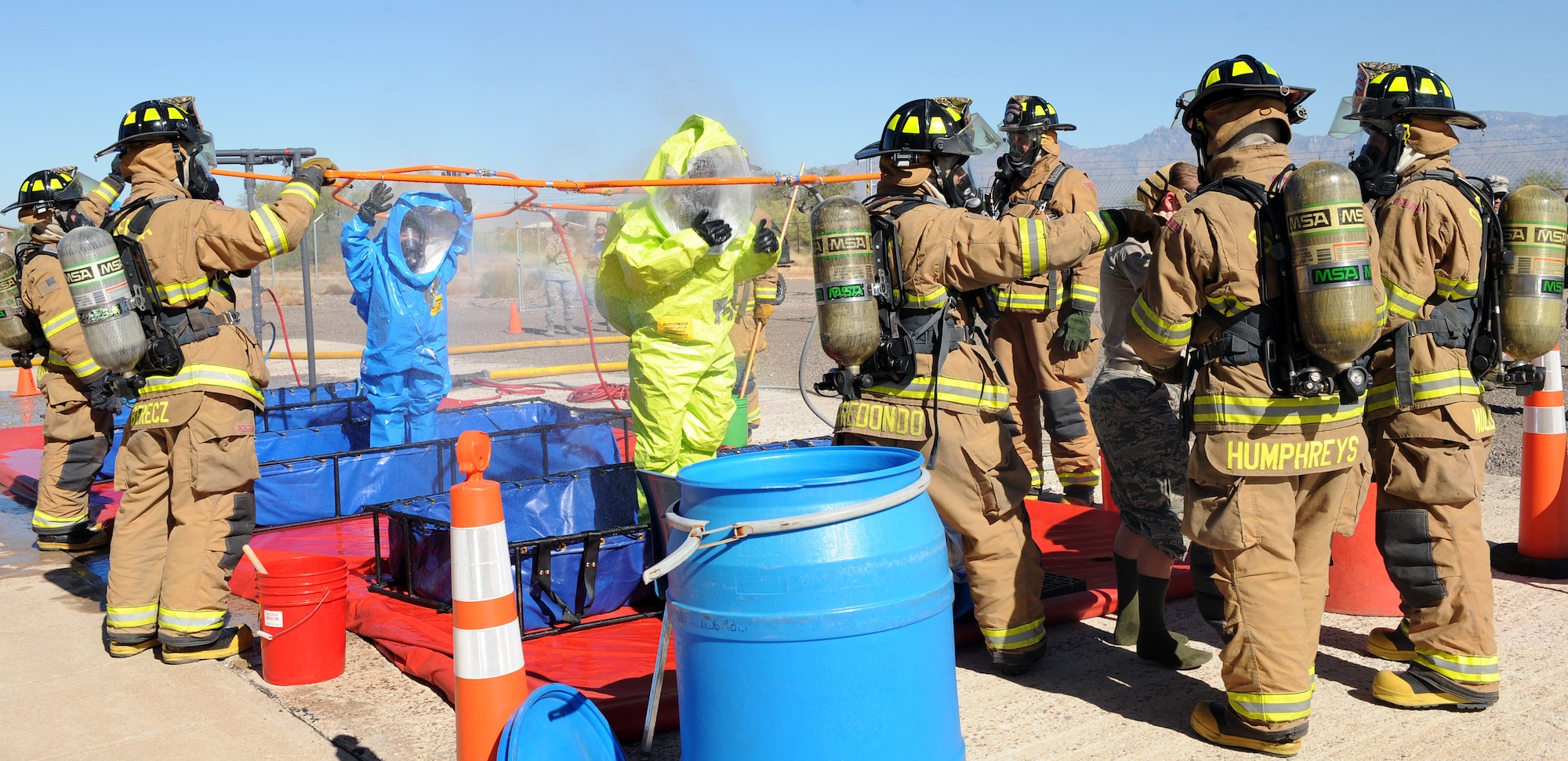 Members of the 355th Civil Engineer Squadron process simulated victims of contamination from the Bioenvironmental Flight during the Response Training and Assessment Program exercise on Davis-Monthan Air Force Base, Oct. 17, 2012. The RTAP program is designed to provide installations a tool to optimize cross-functional emergency responses. (U.S. Air Force photo by Senior Airman Brittany Dowdle/release)