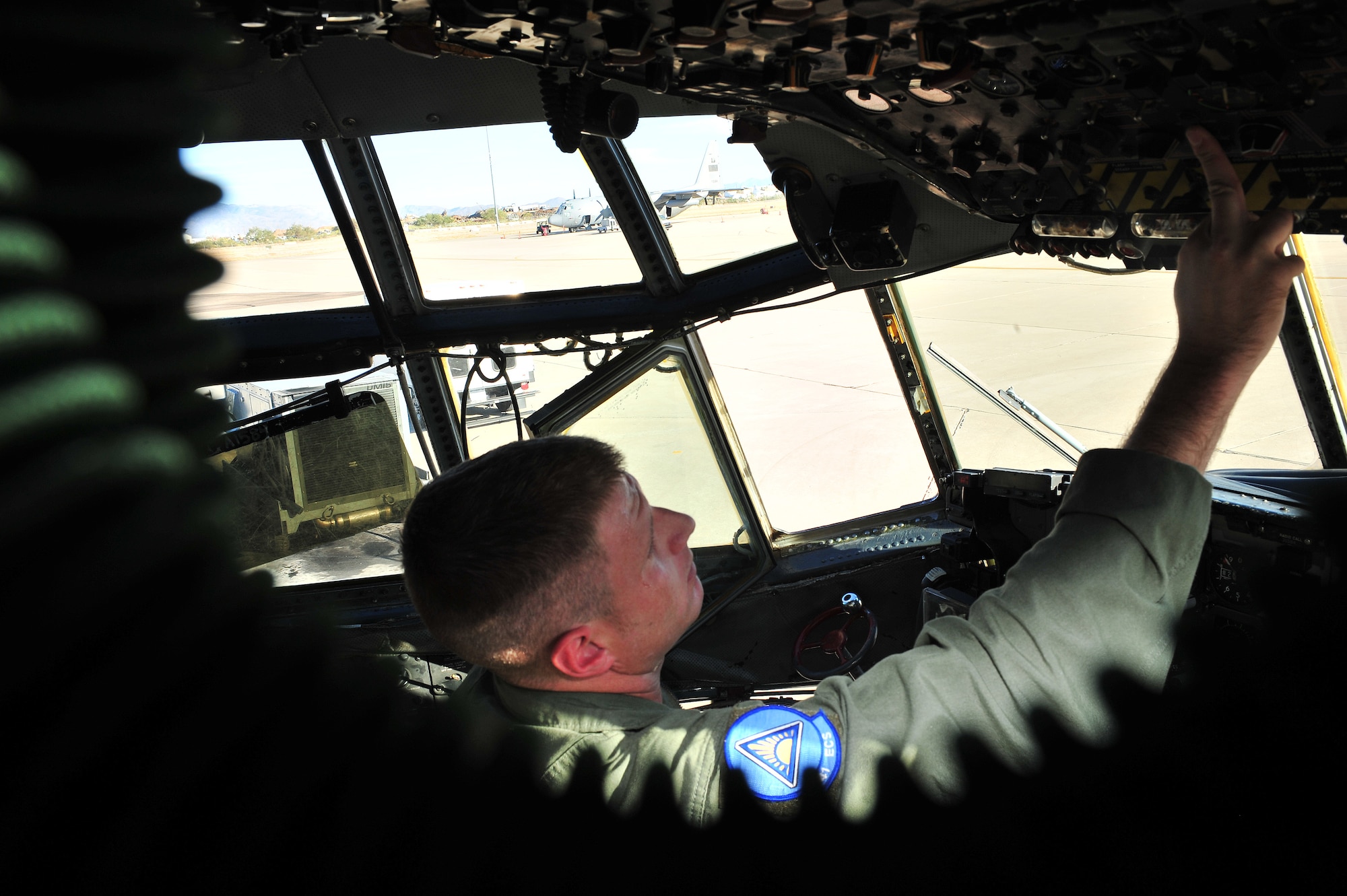 U.S. Air Force Senior Airman Chad Pugh, 41st Electronic Combat Squadron, goes through his preflight safety check on Davis-Monthan Air Force Base, Ariz., Oct. 15, 2012. Airman Pugh has a checklist he must go through to ensure safety throughout the flight. (U.S. Air Force photo by Airman 1st Class Josh Slavin/Released)