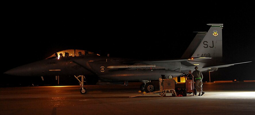 Maj. Frank Fryar, F-15E Strike Eagle pilot, and Capt. Kyle Meyer, weapons systems officer, both with the 335th Fighter Squadron, Seymour Johnson Air Force Base, N.C., wait to taxi down the runway during the early morning on Barksdale Air Force Base, La., Oct. 19. The F-15E Strike Eagle is a dual-role fighter designed to perform air-to-air and air-to-ground missions. An array of avionics and electronics systems gives the F-15 the capability to fly at low altitude, day or night, and in all weather. (U.S. Air Force photo/Senior Airman Kristin High)(RELEASED)
