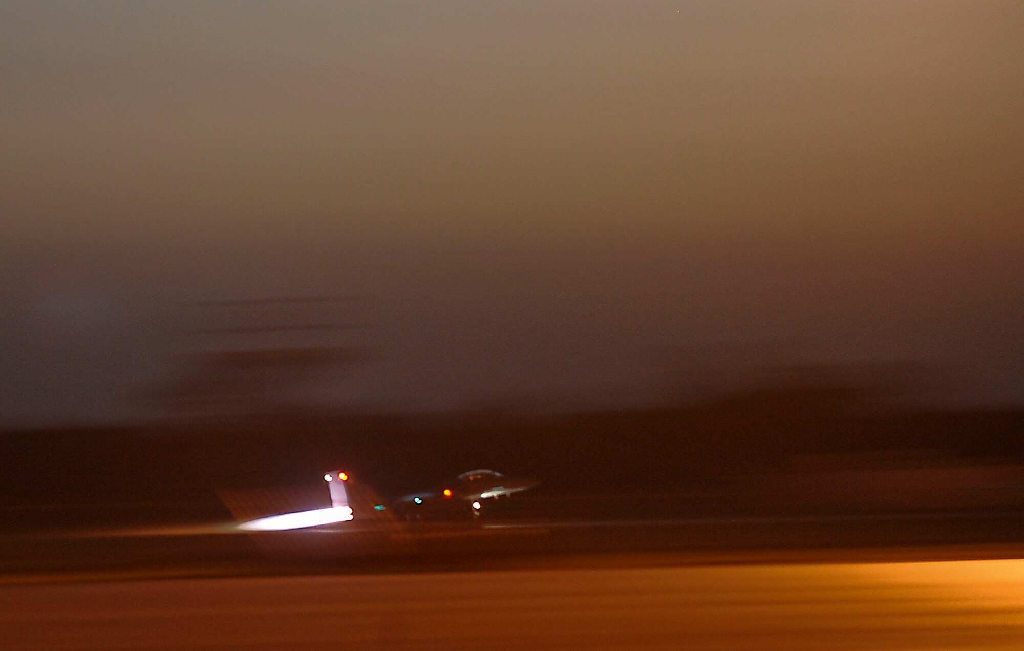 An F-15E Strike Eagle, 335th Fighter Squadron Seymour Johnson Air Force Base, N.C., launches during early morning missions during an exercise on Barksdale Air Force Base, La., Oct. 19. More than 160 Airmen and 12 F-15E Strike Eagles from Seymour Johnson AFB, N.C., are visiting Barksdale for joint training with the 82nd Airborne Division, Fort Bragg, N.C., during Green Flag East. Green Flag East is a joint operation to help service members train for missions during future deployments. (U.S. Air Force photo/Senior Airman Kristin High)(RELEASED)
