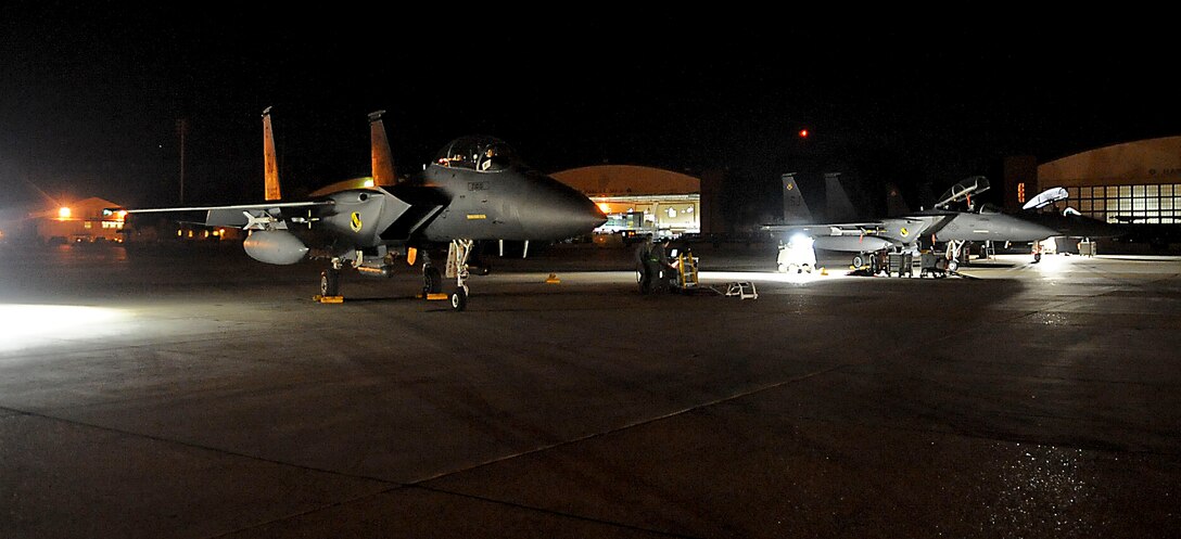 F-15E Strike Eagles, from the 335th Fighter Squadron Seymour Johnson Air Force Base, N.C., prepare to launch for early morning missions on Barksdale Air Force Base, La., Oct. 19. The F-15s will be providing critical close air support, during Green Flag East, to allow the 2nd Brigade of the 82nd Airborne Division, Fort Bragg, N.C., to defend against hostile armored forces. Green Flag East is part of a joint operation to help service members train for missions during future deployments. (U.S. Air Force photo/Senior Airman Kristin High)(RELEASED)
