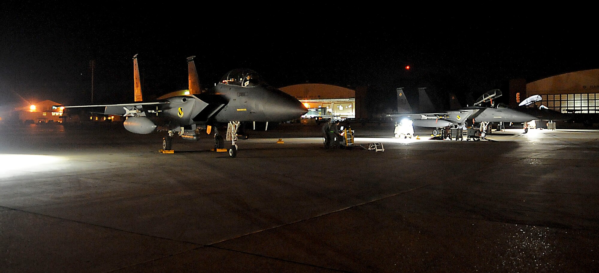 F-15E Strike Eagles, from the 335th Fighter Squadron Seymour Johnson Air Force Base, N.C., prepare to launch for early morning missions on Barksdale Air Force Base, La., Oct. 19. The F-15s will be providing critical close air support, during Green Flag East, to allow the 2nd Brigade of the 82nd Airborne Division, Fort Bragg, N.C., to defend against hostile armored forces. Green Flag East is part of a joint operation to help service members train for missions during future deployments. (U.S. Air Force photo/Senior Airman Kristin High)(RELEASED)

