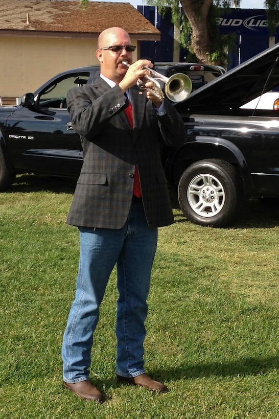 SANTA MARIA , Calif. – Mr. Lawrence Hill, 30th Space Wing Community Relations chief, plays “Taps” on the trumpet during the Santa Barbara County Veterans Stand Down at the Santa Maria Fairgrounds here Saturday, Oct. 13. 2012. The Veterans Stand Down was organized to provide a single place for homeless and nearly-homeless veterans to receive a wide variety of personal assistance. At least 250 veterans benefited from the services which included hot showers, haircuts, new clothing, medical and dental check-ups, financial assistance, legal services, family support, Department of Veterans Affairs information and much more. More than 80 Airmen from Vandenberg Air Force Base volunteered to work the event. (Courtesy Photo)