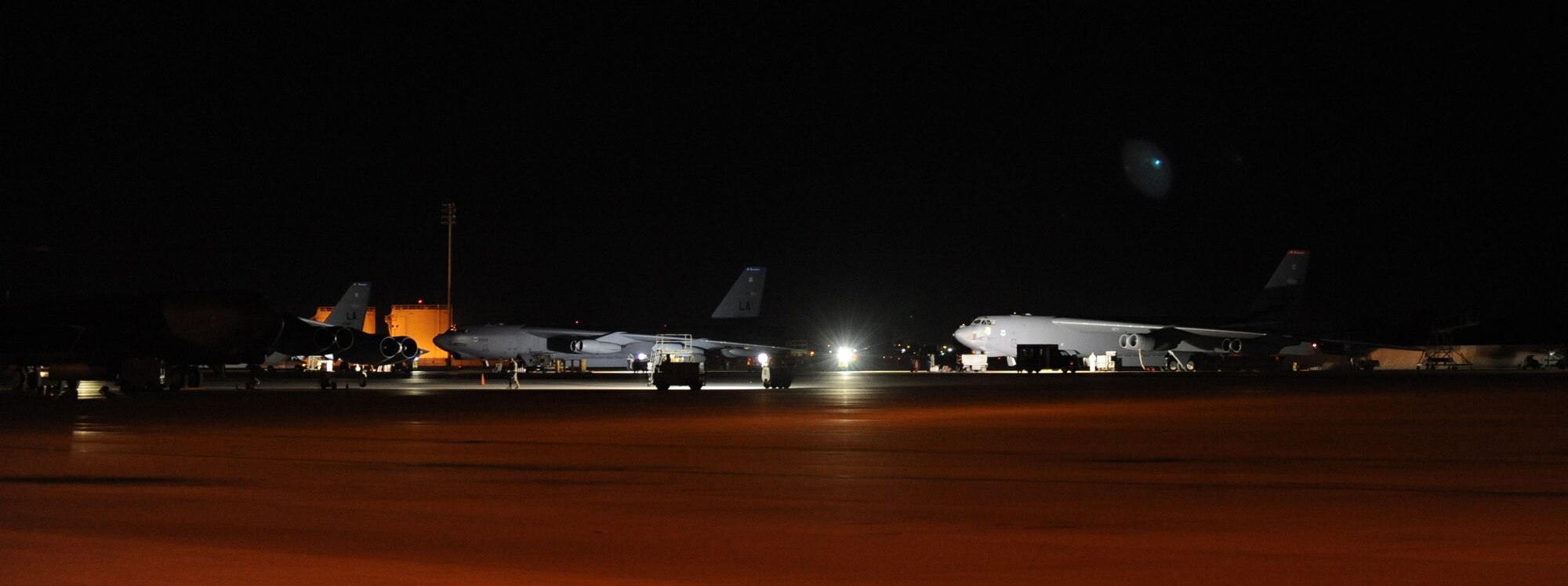 Maintenance crews work on B-52H Stratofortress Bombers in the early morning on Barksdale Air Force Base, La., Oct. 19. With a well-rounded bomber force, the 2nd Bomb Wing and B-52s lead the way in global engagement.  The long range and versatility of the B-52 make it the weapon of choice for providing deterrence, demonstrating U.S. resolve and combat operations around the world. (U.S. Air Force photo/Senior Airman Kristin High)(RELEASED)

