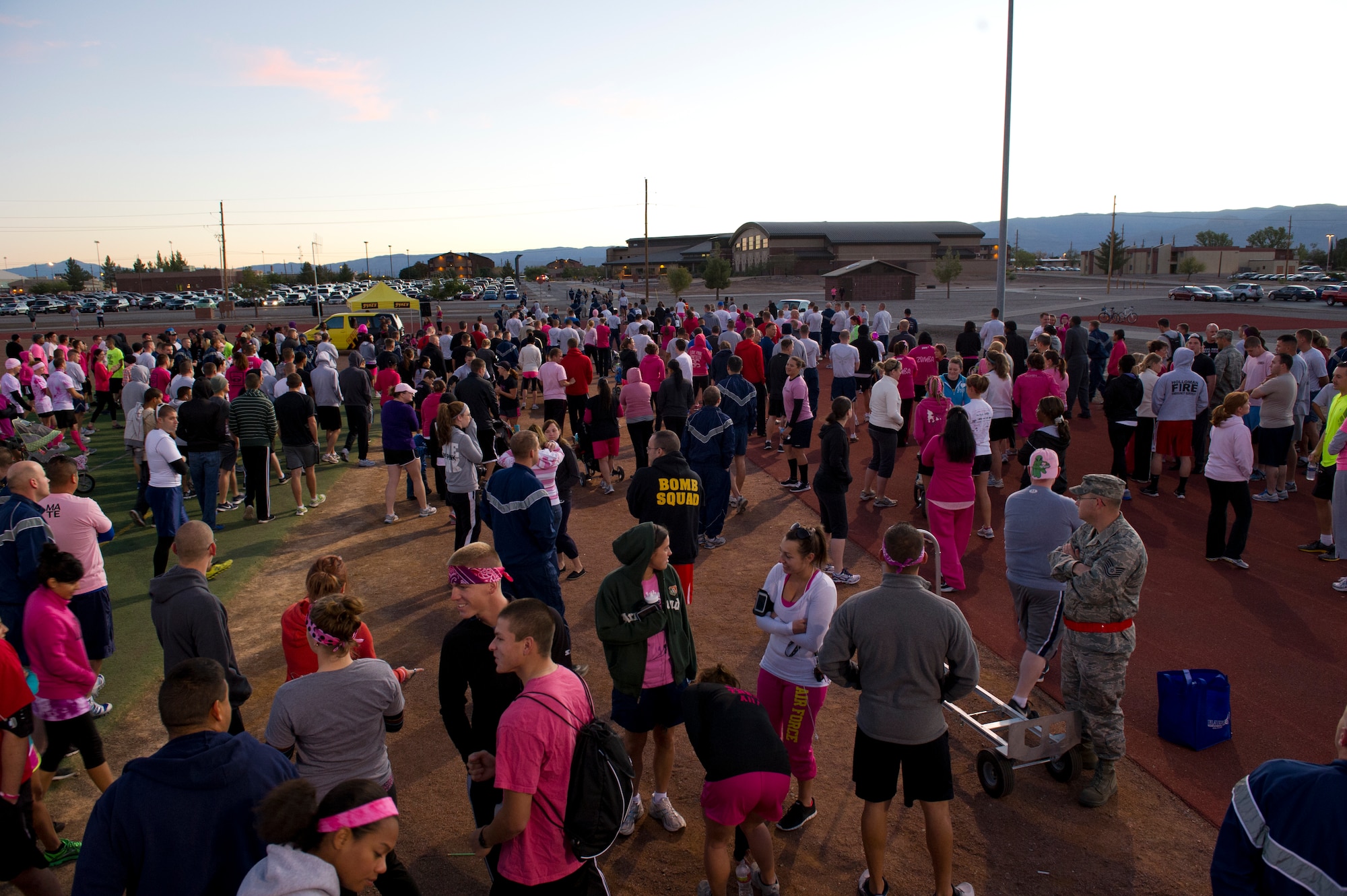 Members of Team Holloman gather to participate in a 5k run/walk for breast cancer awareness at Holloman Air Force Base, N.M., Oct. 19. More than 500 people participated in the run. The run was sponsored by the 49th Medical Group’s Health and Wellness Center and Women’s Health Clinic. (U.S. Air Force photo by Senior Airman Kasey Close/Released)