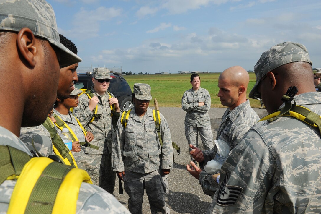 U.S. Air Force Tech Sgt. Jason Smith, 633rd Aerospace Medicine Squadron Bio-environmental engineer, conducts a respirator protection briefing for members of the 633rd Force Support Squadron search-and-recovery team during a major accident response exercise at Langley Air Force Base, Va., Oct. 19, 2012. The exercise was held to assess how well members of the base rescue casualties during a major accident. (U.S. Air Force photo by Staff Sgt. Ashley Hawkins/Released) 