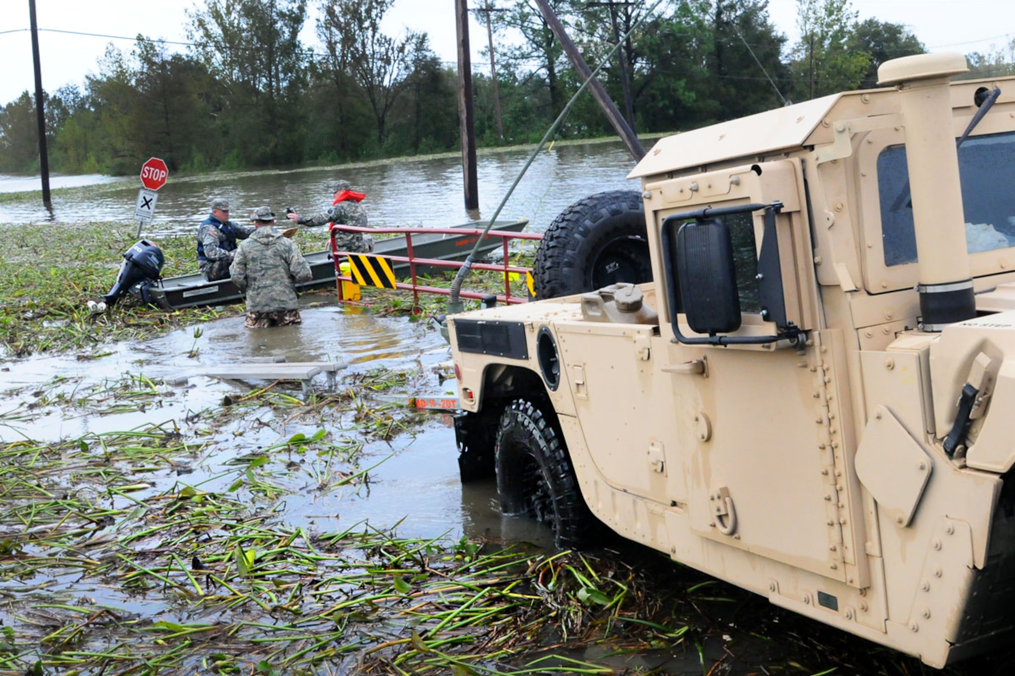 Soldiers and Airmen of the Louisiana National Guard launch a boat for search and rescue operations in Braithwaite, La., Aug. 30, 2012. The state activated more than 7,000 Louisiana Guardsmen to assist area residents along with local and state authorities in support of Hurricane Isaac relief. (U.S. Air Force photo by Master Sgt. Dan Farrell/RELEASED)